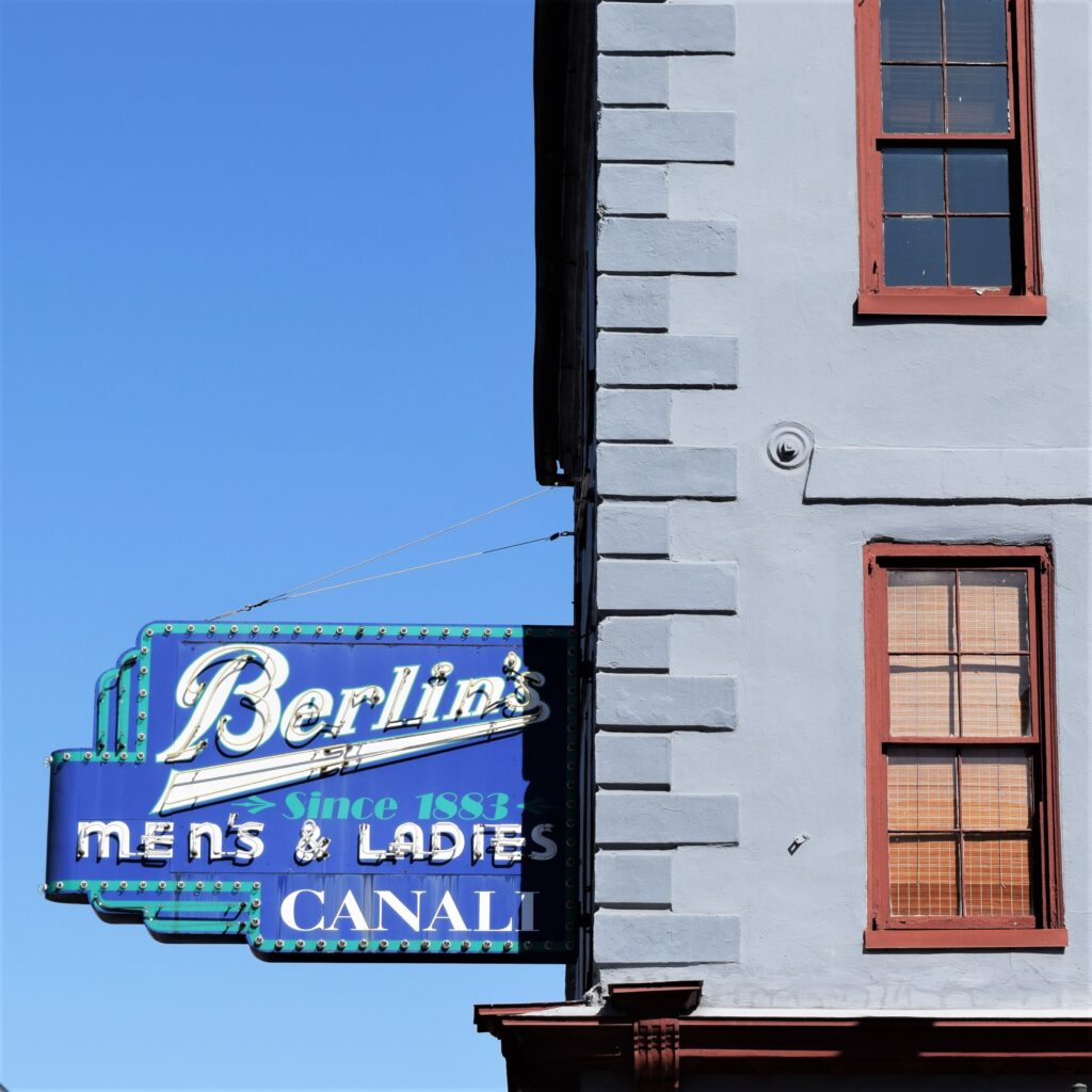 slow travel Charleston south, charleston south carolina southern historic travel blue sky old sign typography blue old building historic district brown window trim quoins art photography urban