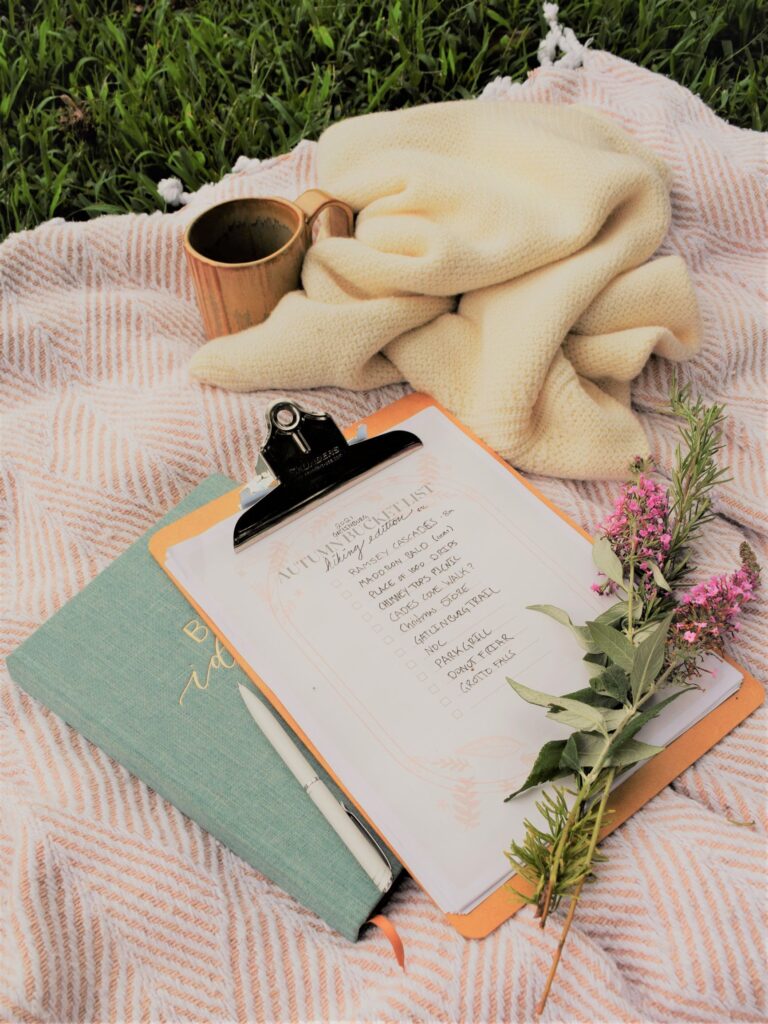 fall bucket list flowers on a blanket dreamy planning book picnic mug white sweater
