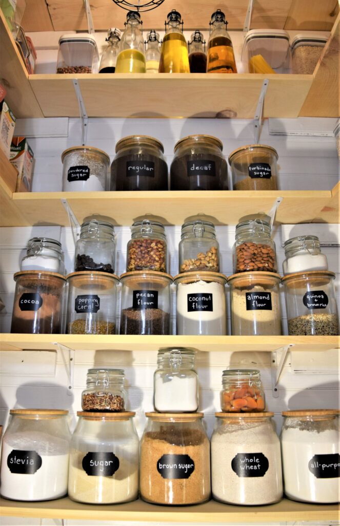 small farmhouse pantry organization black white wood tiny labels jars renovation diy