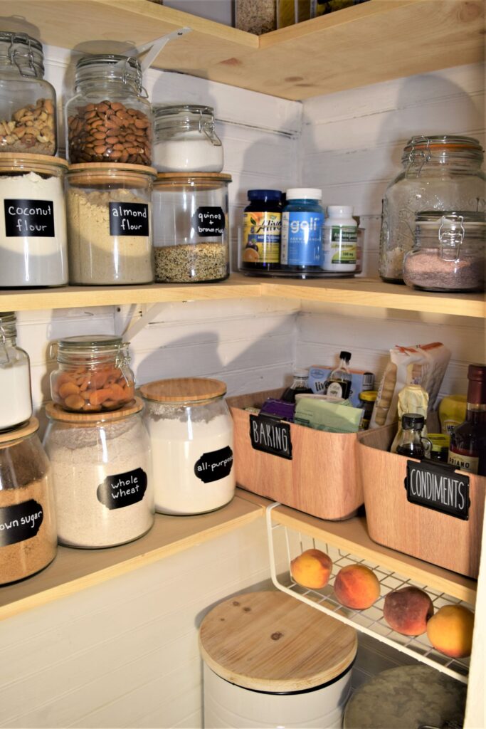 small farmhouse pantry organization black white wood tiny labels jars renovation diy