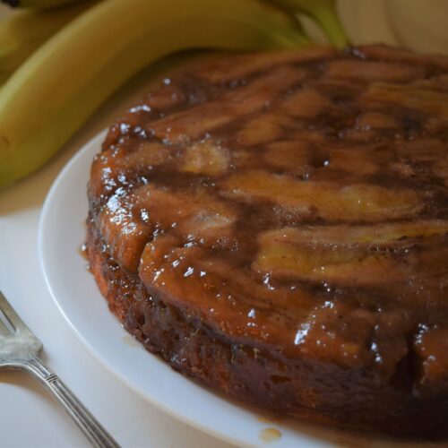 Bananas Foster Upside Down Cake, island, tropical, summer, kitchen, hands slicing cake, dessert, baking, rum, spice, easy, simple