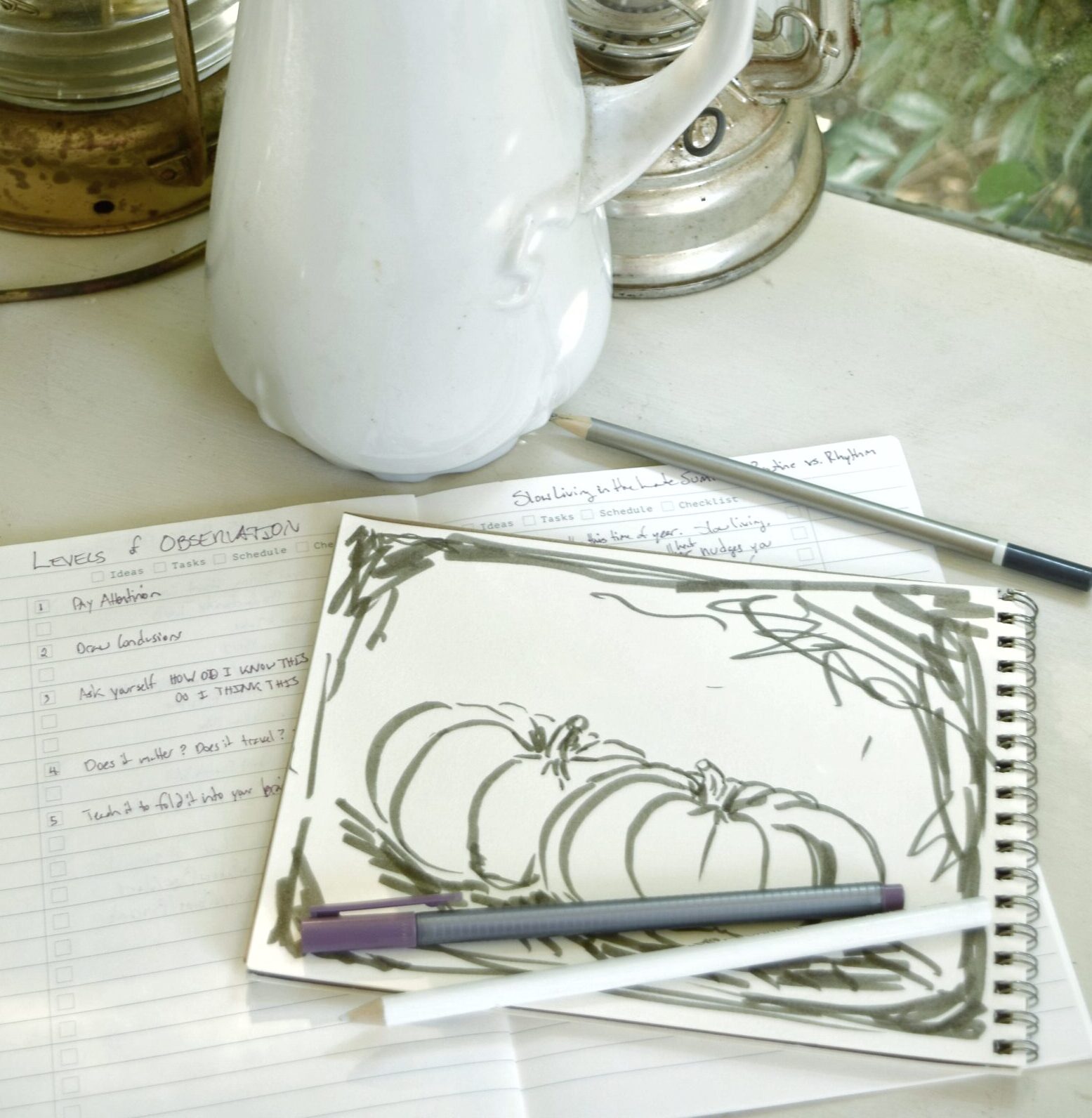 Slow living routine rhythm, vase of white summer flowers, list, sketching pumpkins