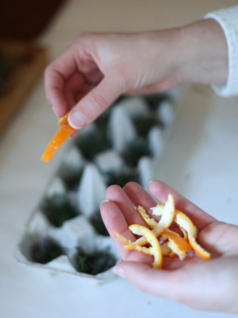 fire starters styled in a vintage lusterware bowl, orange and evergreen